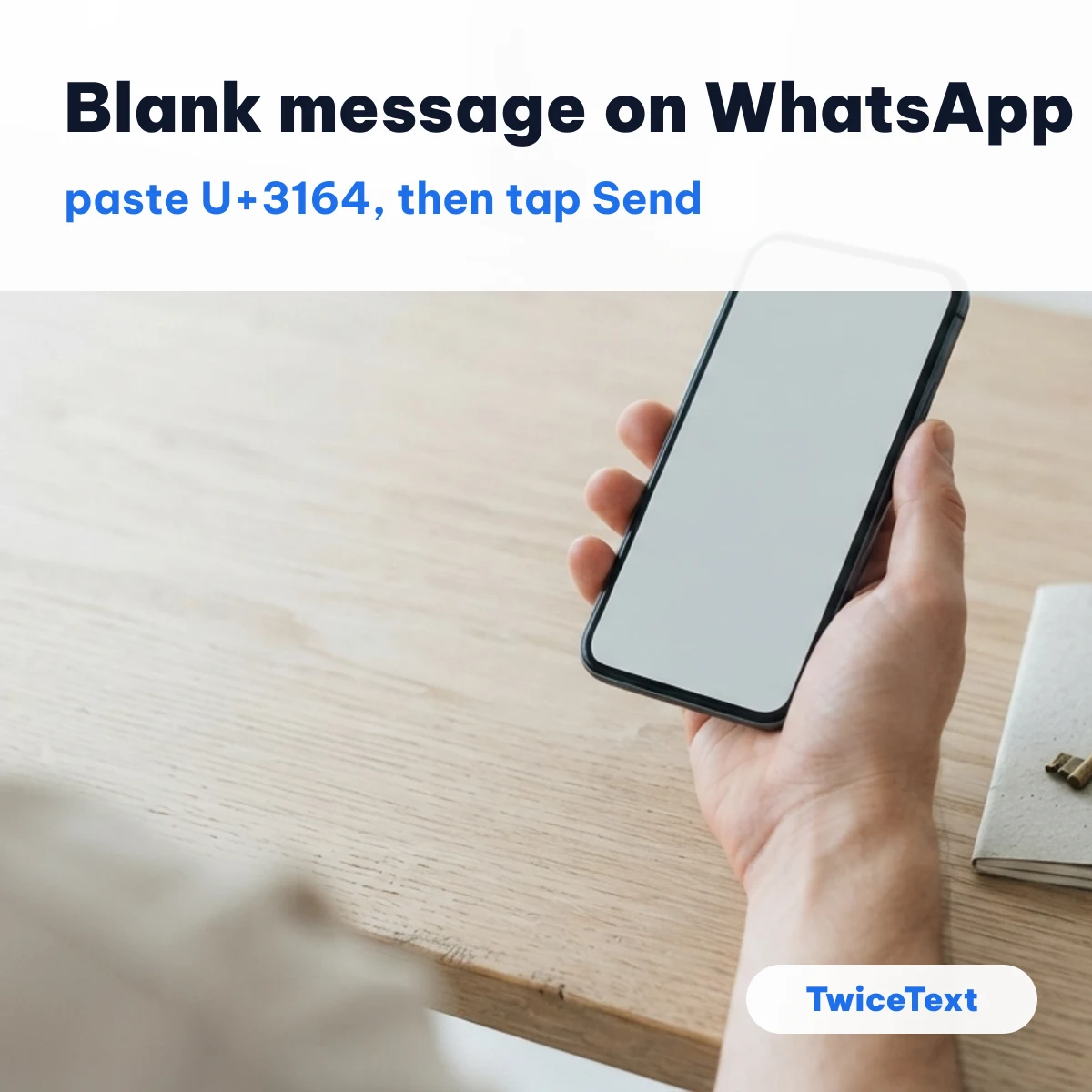 Hand holding a phone with an empty chat ready to send a blank message on WhatsApp