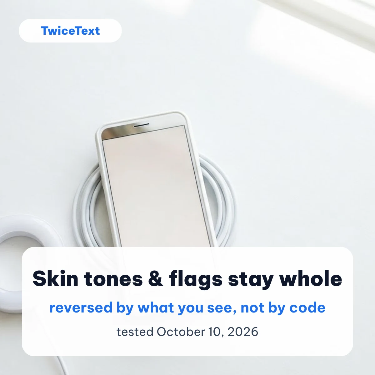 Phone on a white desk with a note that skin tones and flags stay whole when text is reversed